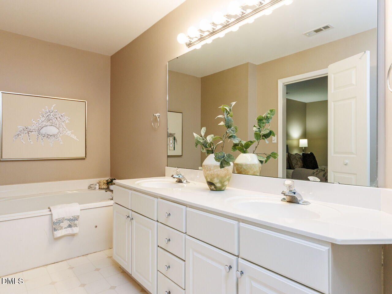 1221 Renshaw Court Cary, NC 27518 - Photo 19 of 29 a bathroom with a double vanity sink and a mirror