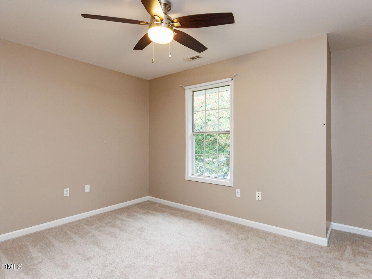 1221 Renshaw Court Cary, NC 27518 - Photo 23 of 29 an empty room with a window and a fan