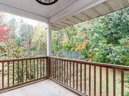 a view of a porch with wooden floor and outdoor space
