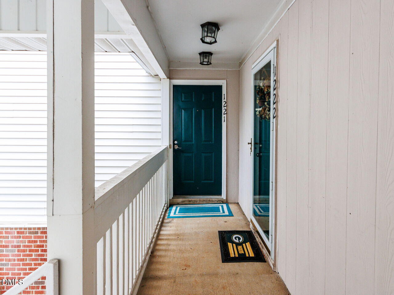 1221 Renshaw Court Cary, NC 27518 - Photo 4 of 29 a view of a hallway with wooden floor and windows