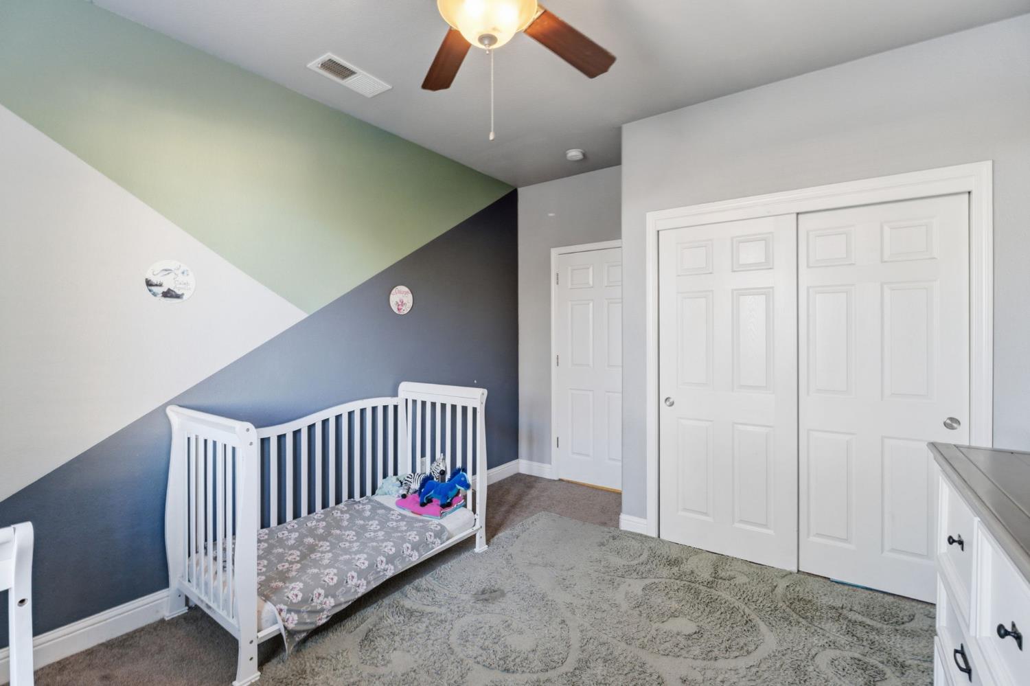 15717 West Botelho Avenue Kerman, CA 93630 - Photo 13 of 43 a view of a hallway with entryway and bedroom