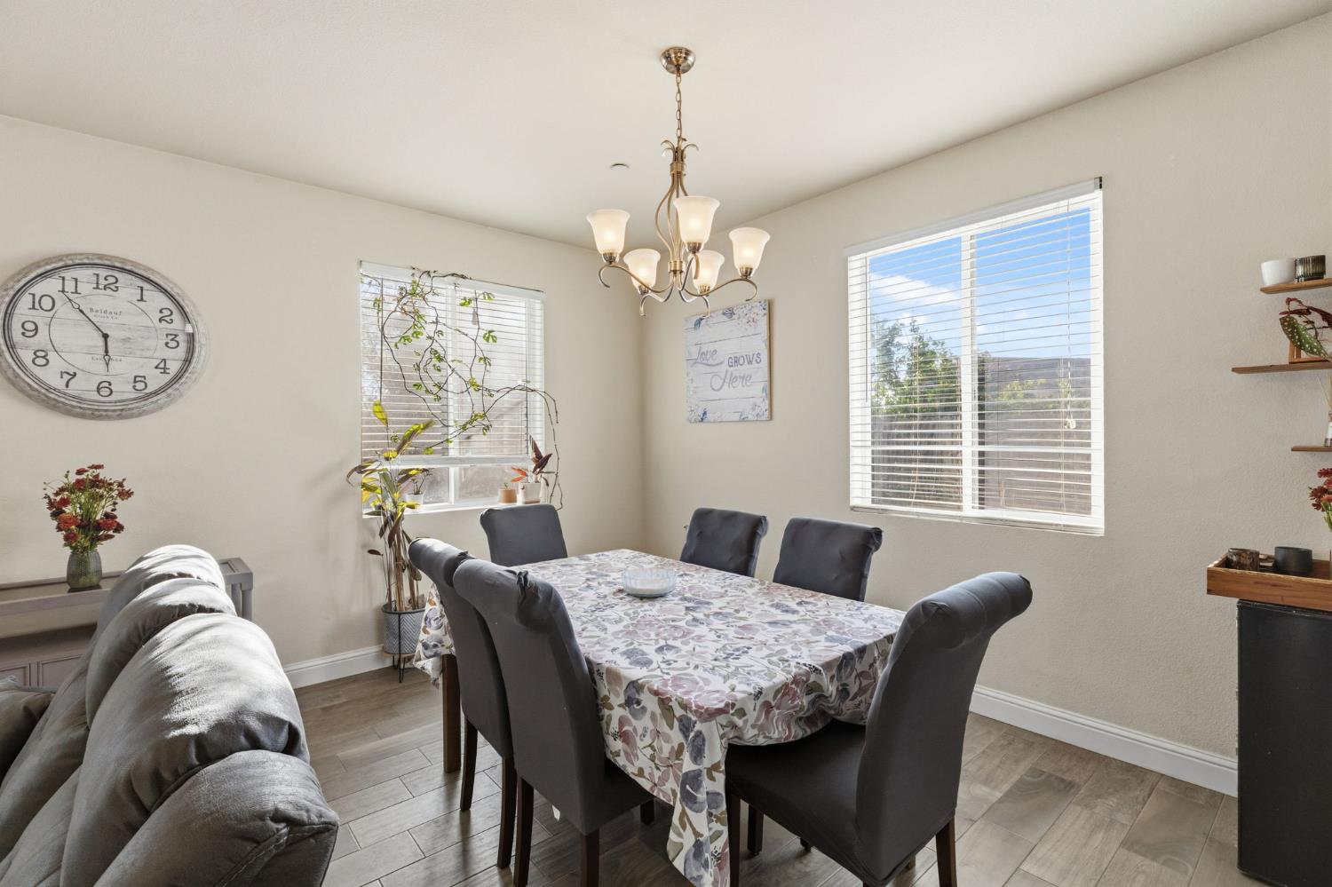 15717 West Botelho Avenue Kerman, CA 93630 - Photo 18 of 43 a view of a dining room with furniture window and wooden floor