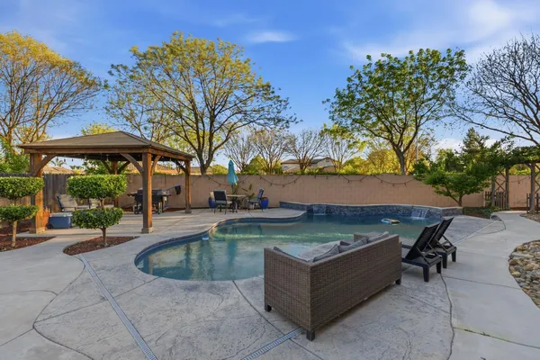 a view of a swimming pool with lounge chair