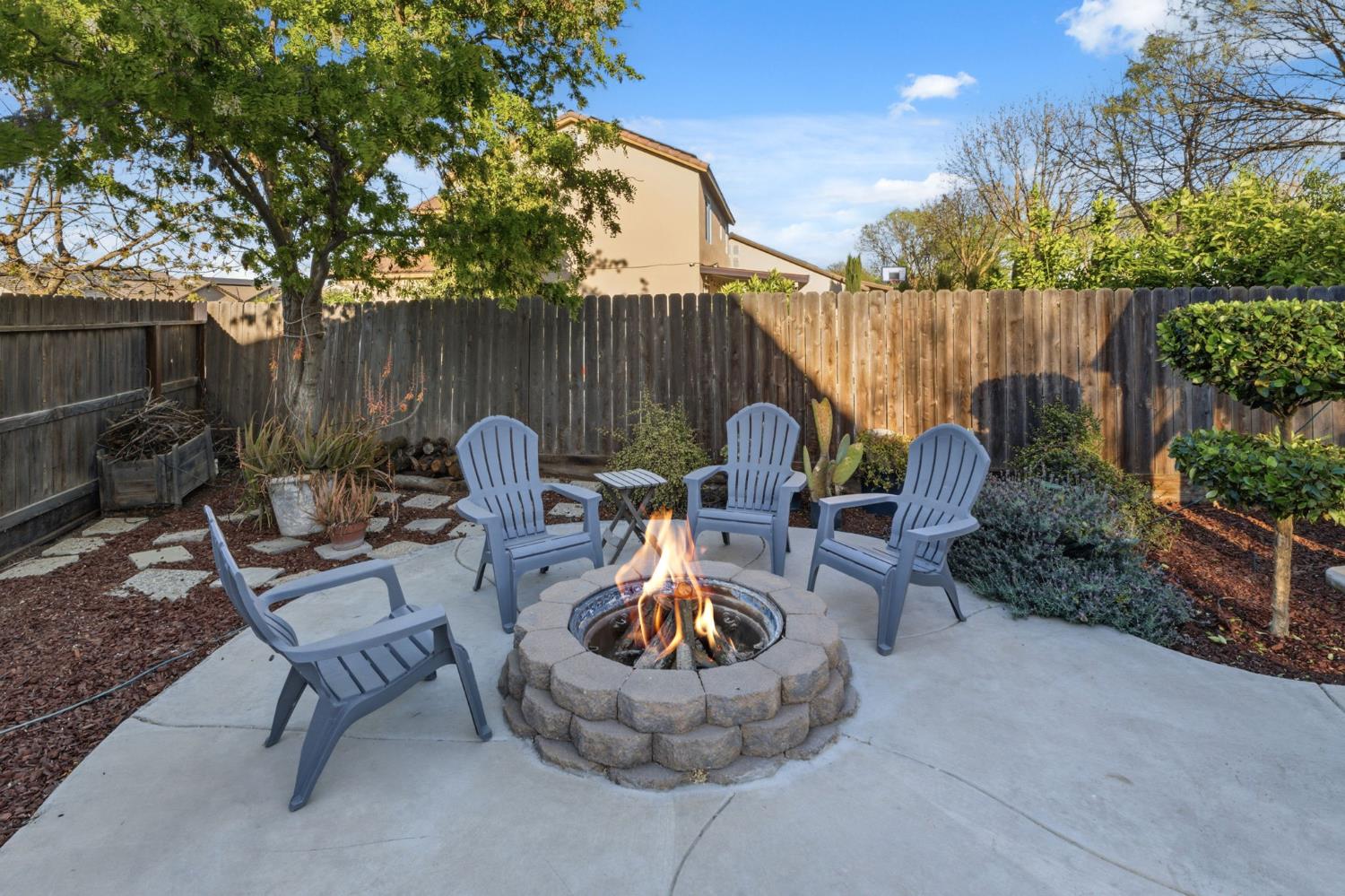 15717 West Botelho Avenue Kerman, CA 93630 - Photo 33 of 43 a backyard of a house with table and chairs