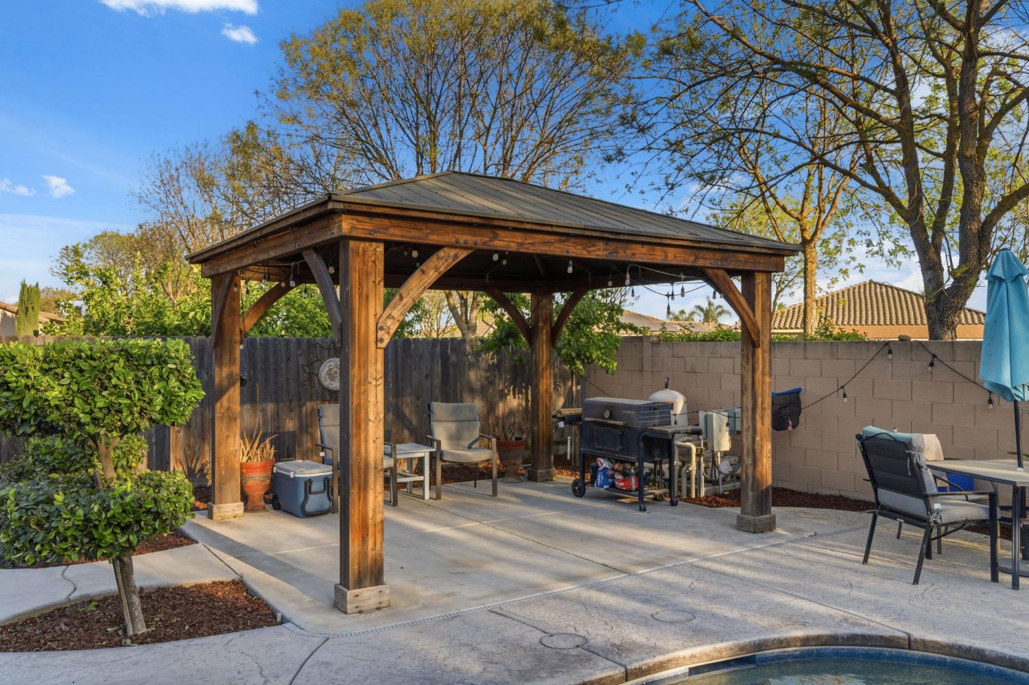15717 West Botelho Avenue Kerman, CA 93630 - Photo 34 of 43 a view of a chairs and table in the patio