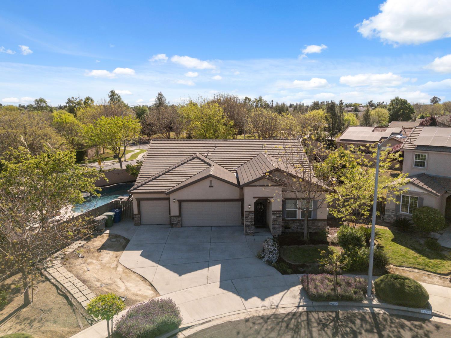 15717 West Botelho Avenue Kerman, CA 93630 - Photo 36 of 43 a view of a house with a yard
