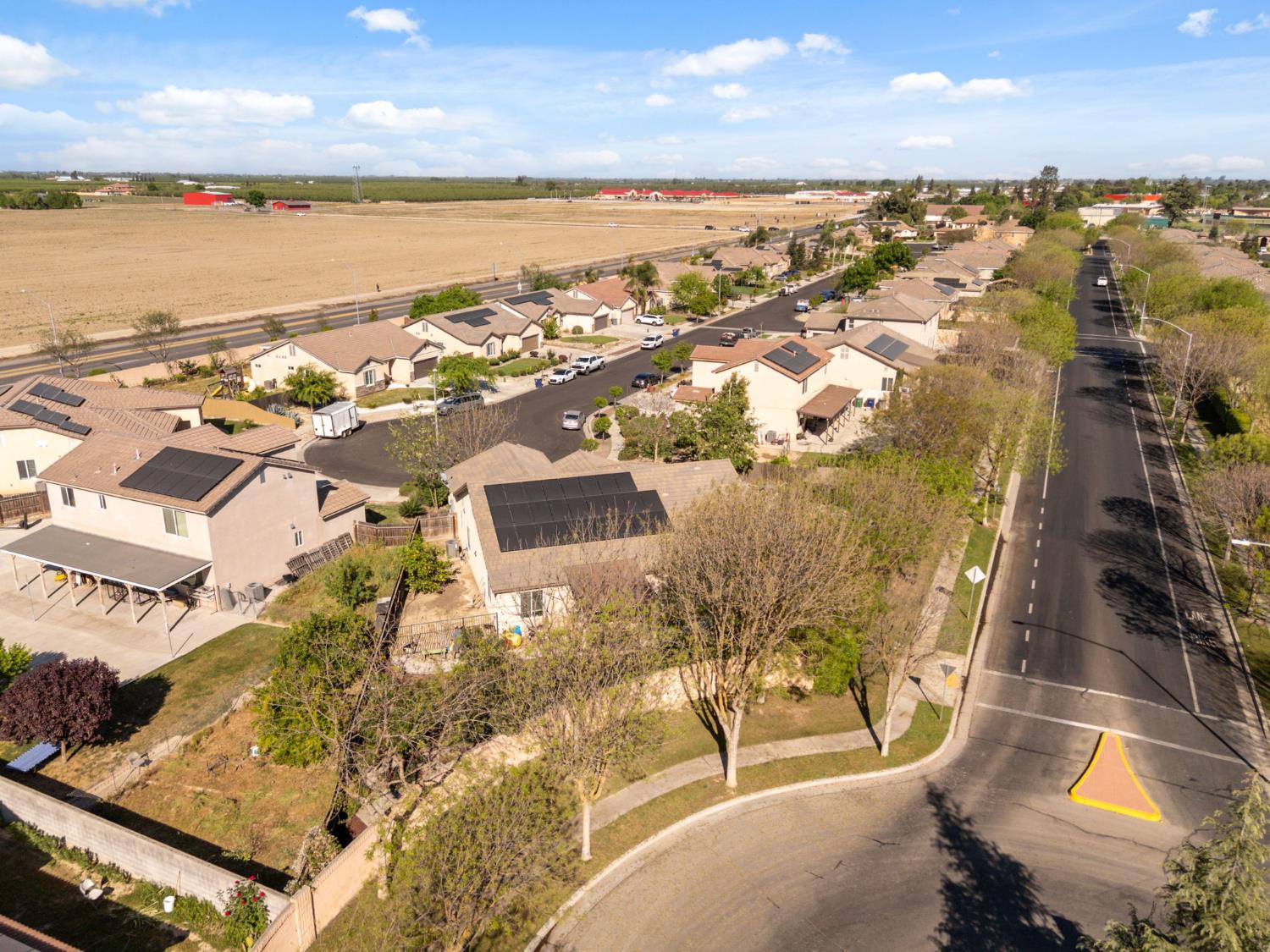 15717 West Botelho Avenue Kerman, CA 93630 - Photo 42 of 43 an aerial view of residential houses with outdoor space