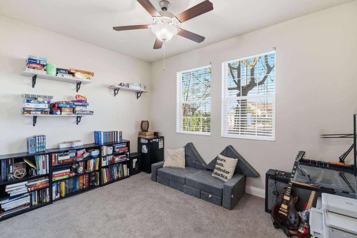 15717 West Botelho Avenue Kerman, CA 93630 - Photo 7 of 43 a living room with lots of furniture and a book shelf