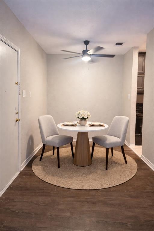 5620 Live Oak Street, Unit 306 Dallas, TX 75206 - Photo 2 of 8 a view of a dining room with furniture and wooden floor