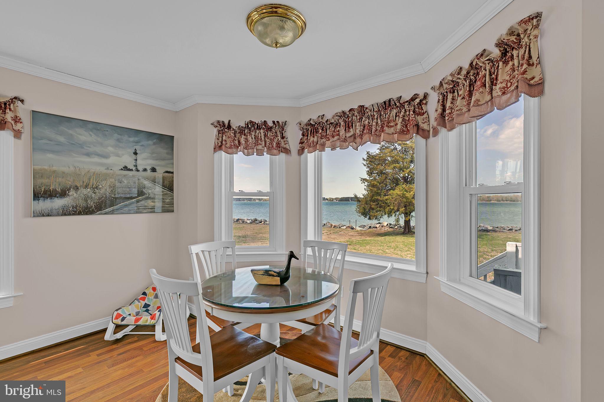 1887 Point Breeze Road Hudgins, VA 23076 - Photo 52 of 77 a view of a dining room with furniture window and wooden floor