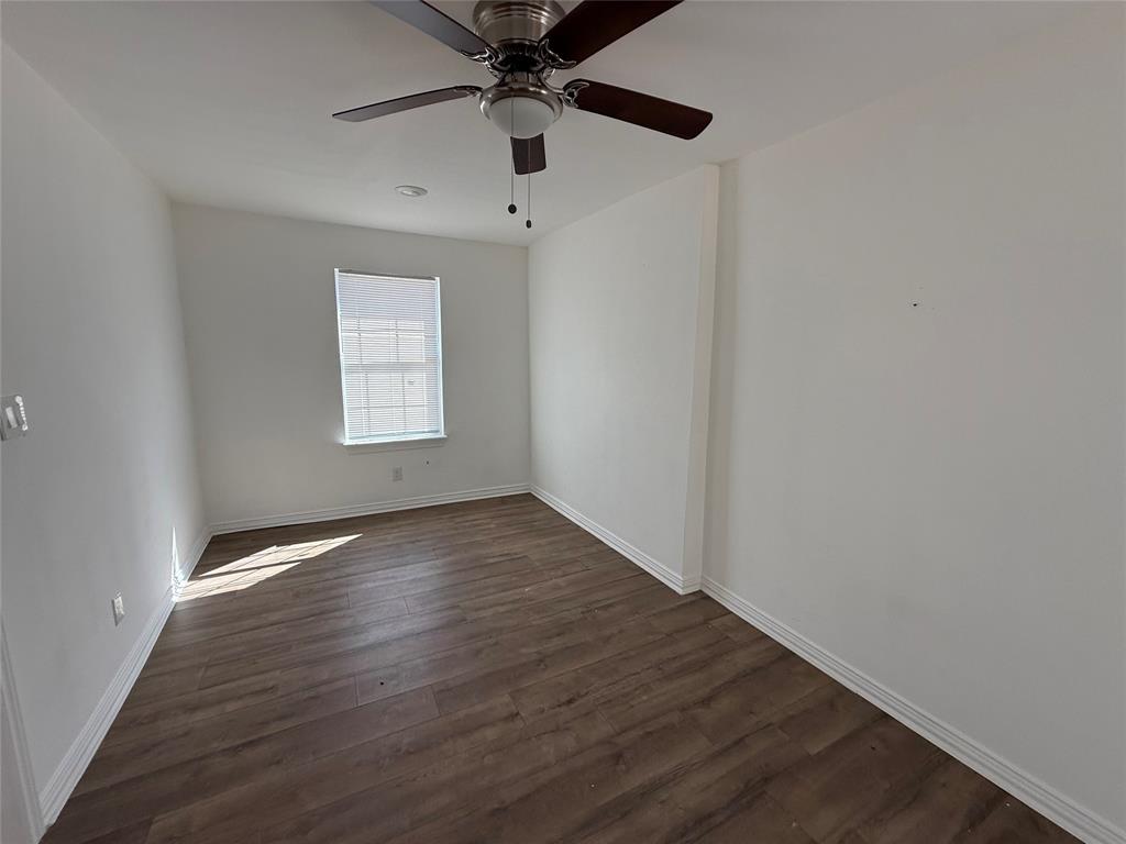 3233 Springview Avenue Dallas, TX 75216 - Photo 8 of 11 Wood-finish flooring, ceiling fan with integrated lighting, recessed ceiling lighting, and a window with blinds