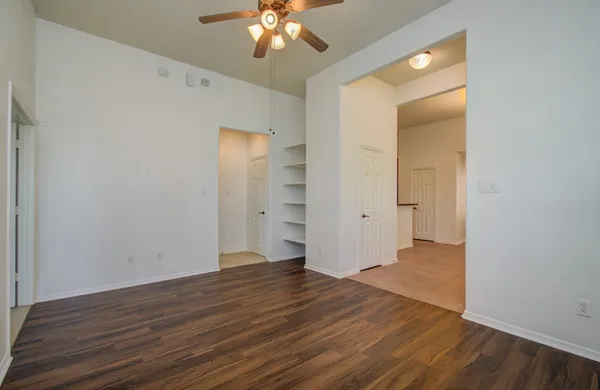 wooden floor in an empty room with a gallery