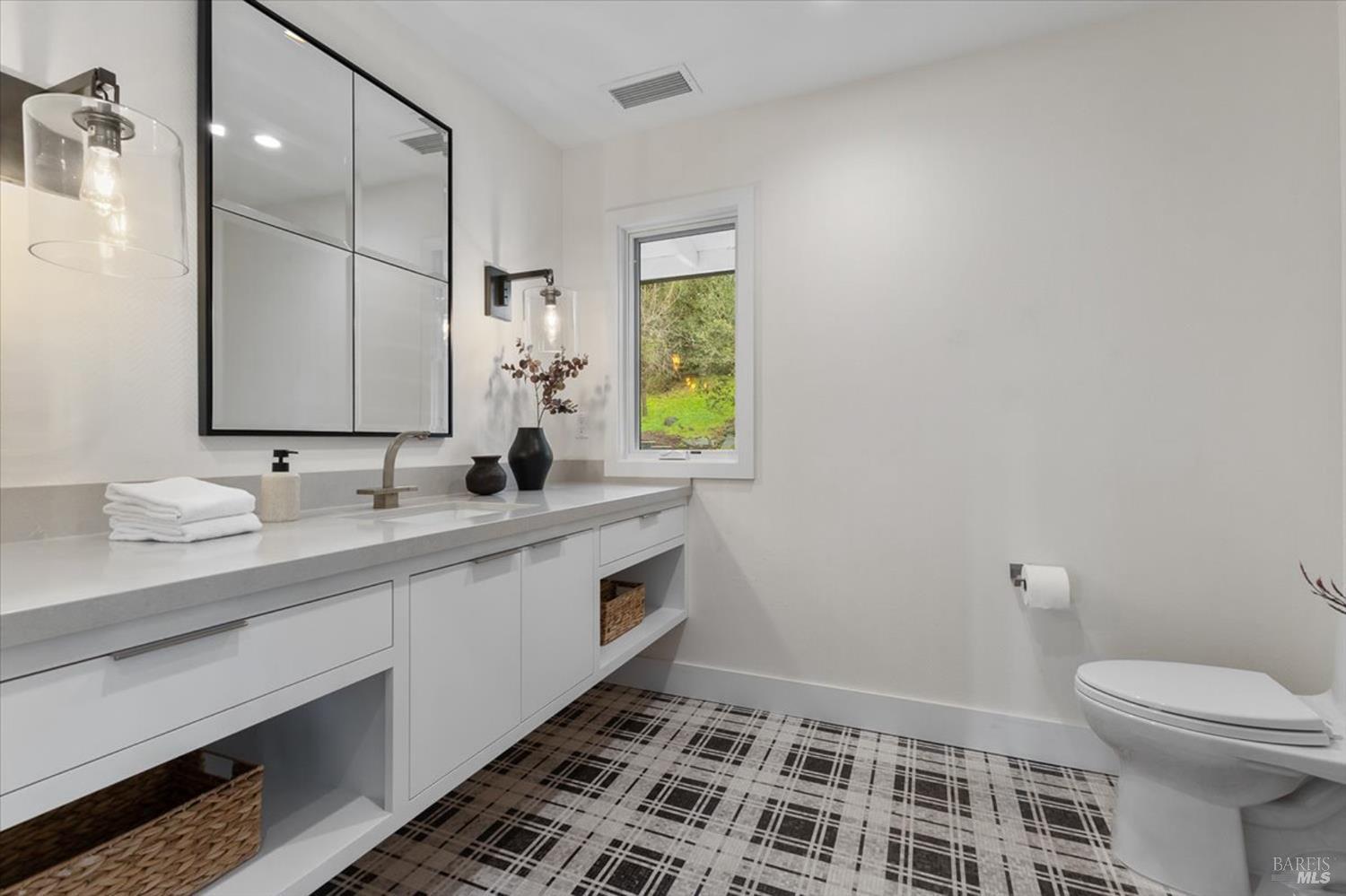 775 Benjamin Way Healdsburg, CA 95448 - Photo 35 of 96 a bathroom with a sink and a mirror