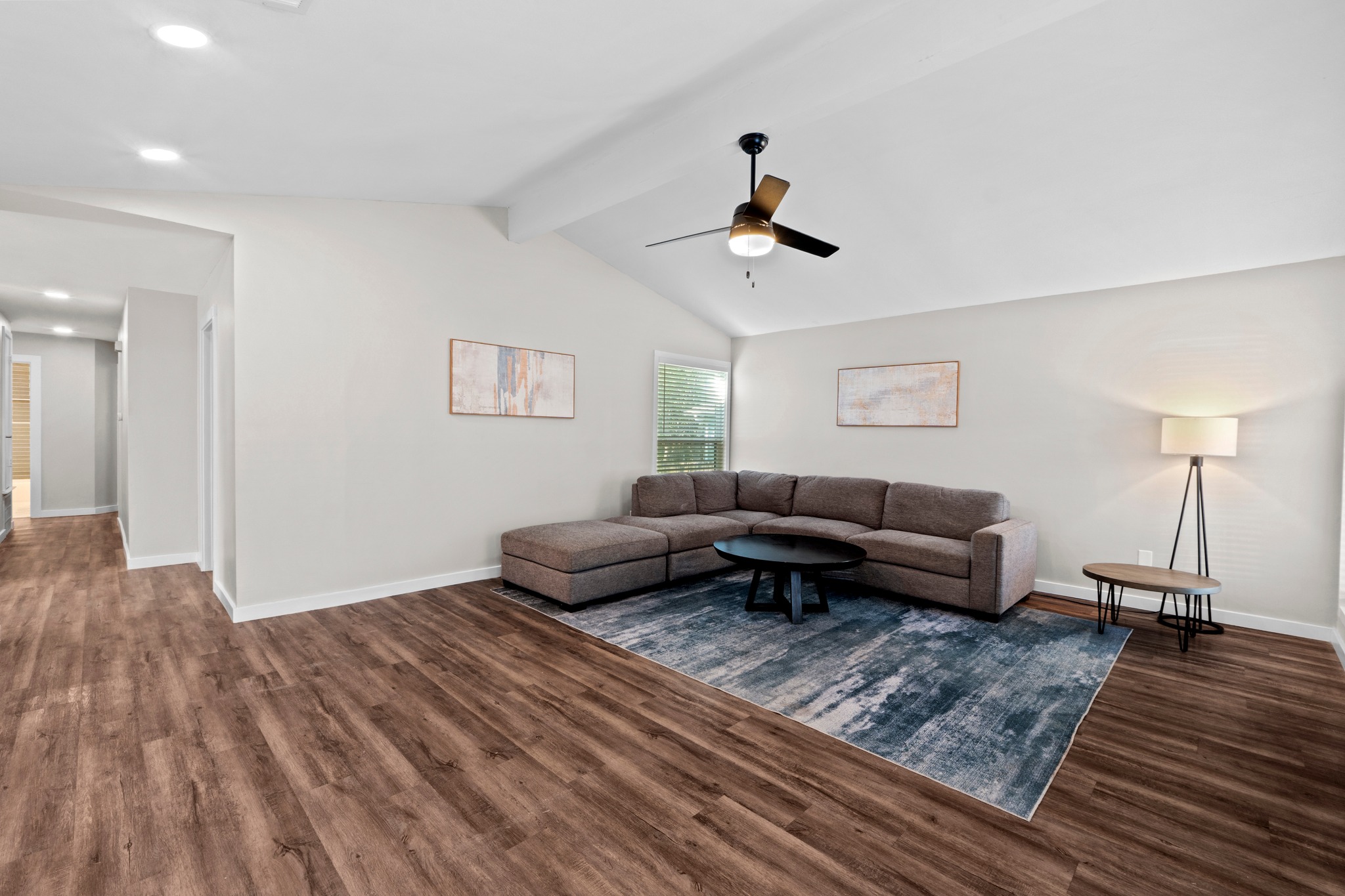11811 Rotherham Drive Austin, TX 78754 - Photo 4 of 37 Soaring vaulted ceilings complement wood flooring in this inviting living space.