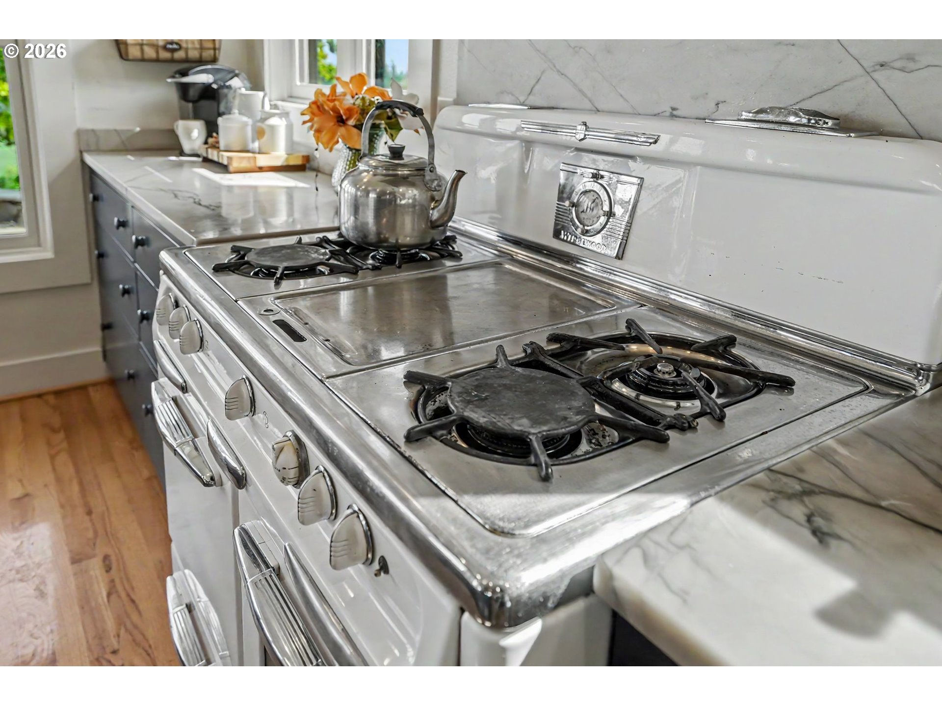17135 Herigstad Road Northeast Silverton, OR 97381 - Photo 11 of 48 a kitchen with a stove cabinets and wooden floor