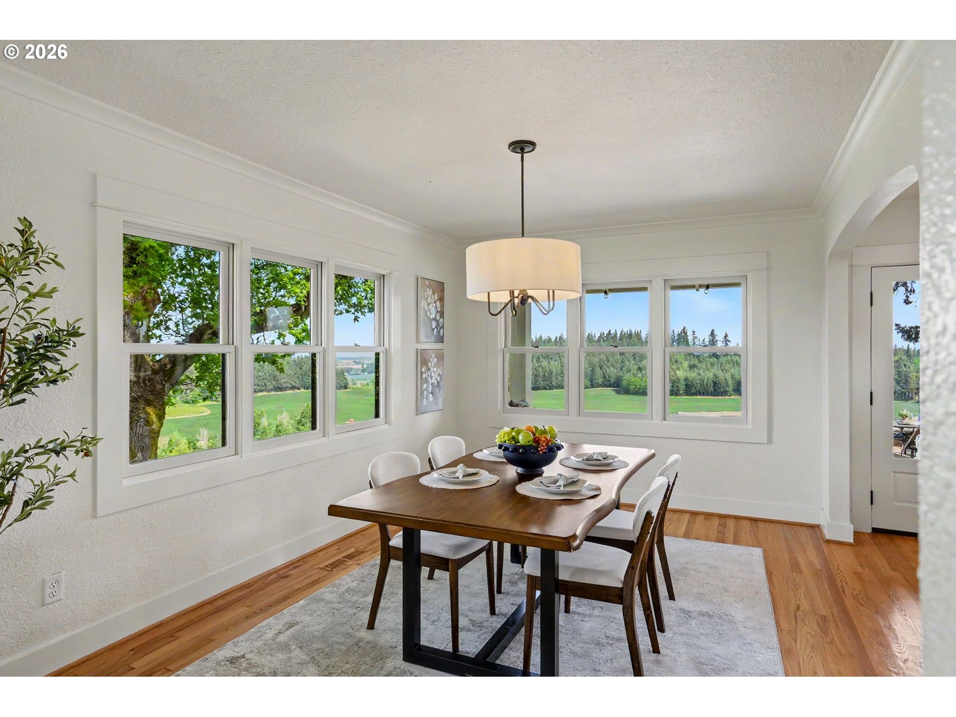 17135 Herigstad Road Northeast Silverton, OR 97381 - Photo 16 of 48 a dining room with furniture window outside view and wooden floor
