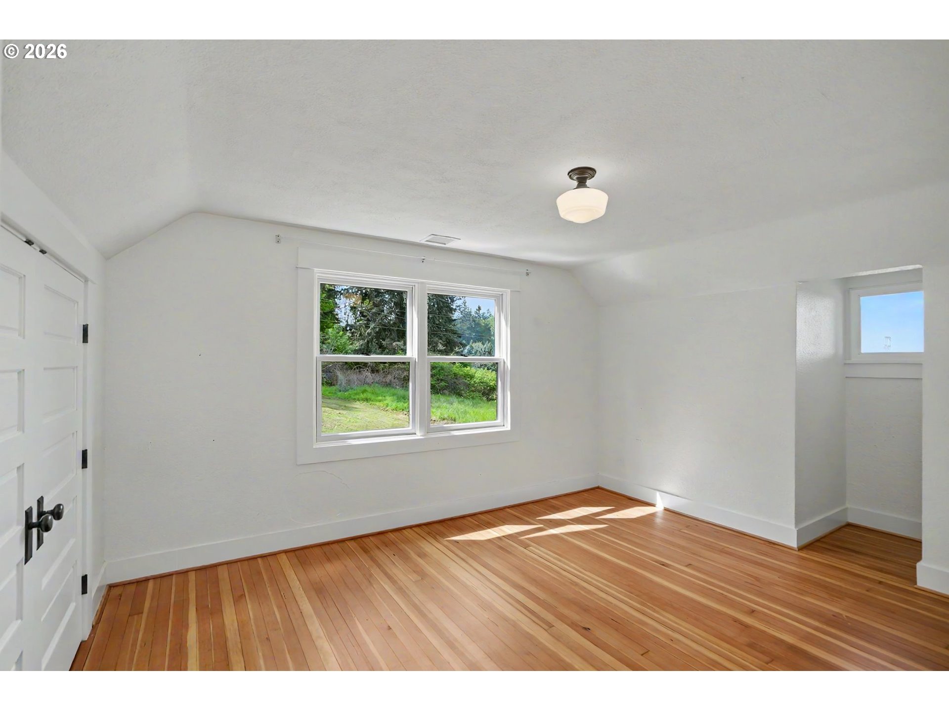 17135 Herigstad Road Northeast Silverton, OR 97381 - Photo 33 of 48 a view of an empty room with wooden floor and a window