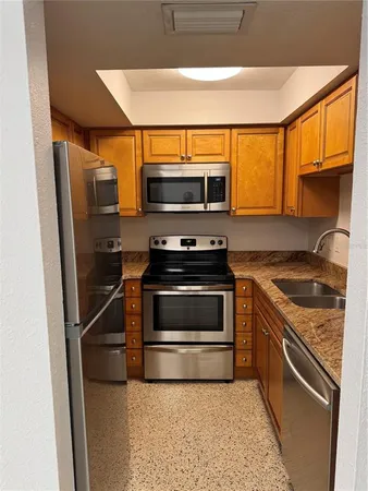 a kitchen with a stove and a microwave