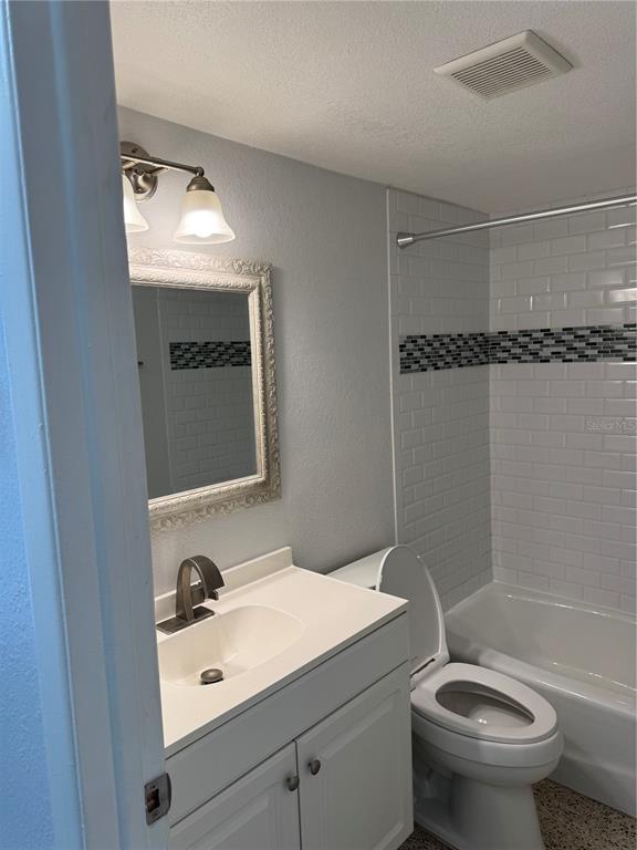 4200 1st Street Northeast, Unit 2 St. Petersburg, FL 33703 - Photo 3 of 5 a bathroom with a sink toilet and shower