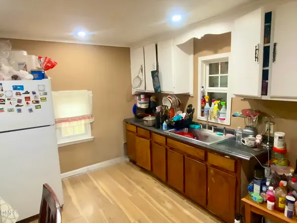 a kitchen with stainless steel appliances a refrigerator and a sink