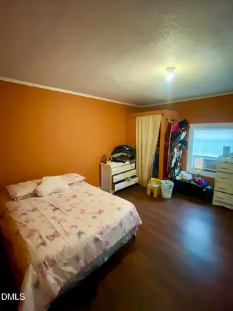 a bedroom with a bed and a view of bedroom