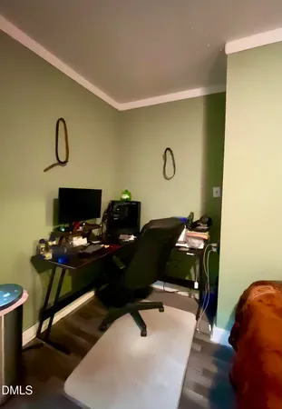 a bathroom with a toilet and a mirror