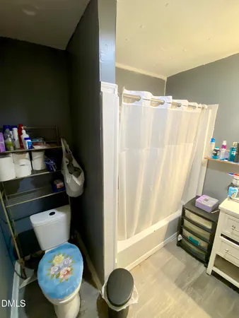 a room with a bed and a mirror