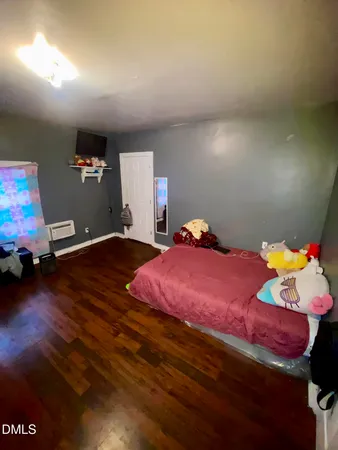 a bed room with a bed and a gym