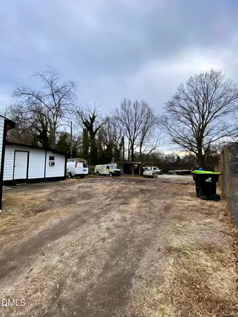 a view of road with large trees