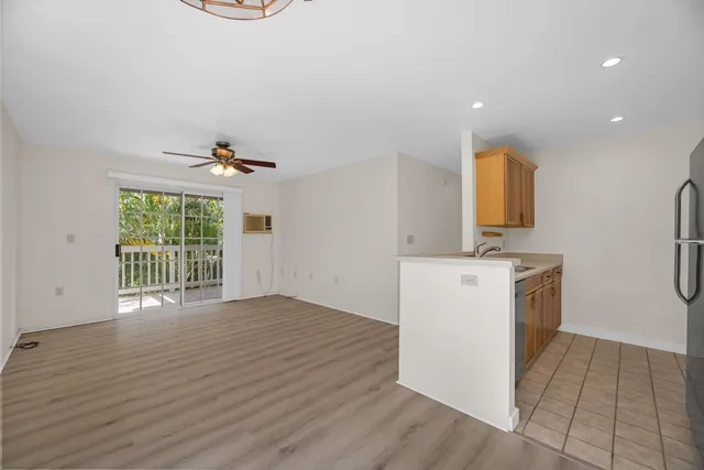 a view of kitchen with furniture and wooden floor