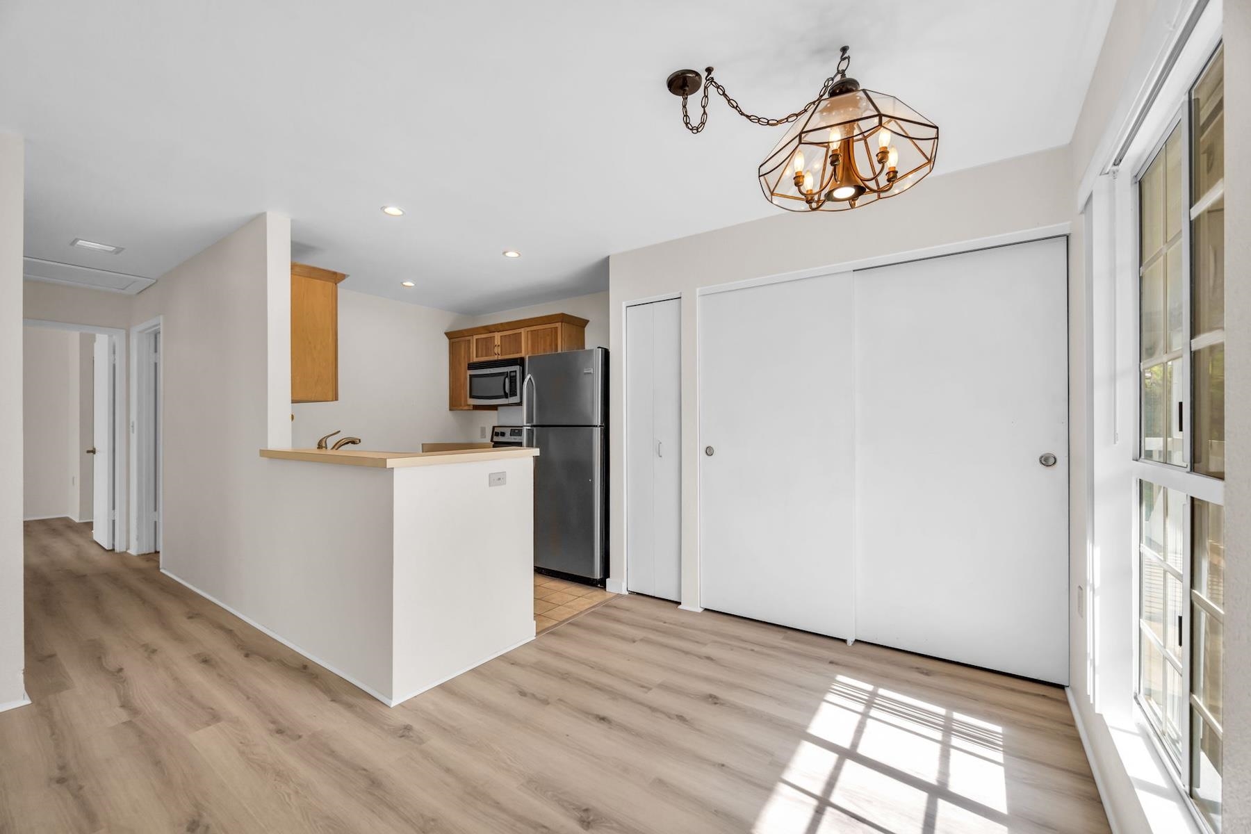 160 Keonekai Road, Unit 18202 Kihei, HI 96753 - Photo 12 of 25 a view of kitchen with furniture and wooden floor