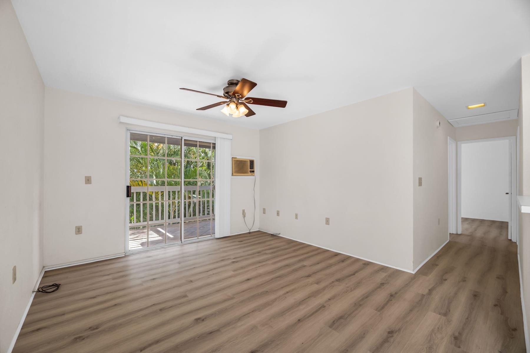 160 Keonekai Road, Unit 18202 Kihei, HI 96753 - Photo 13 of 25 wooden floor in an empty room with a window