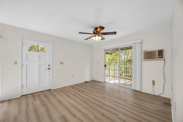a kitchen with a sink cabinets and window