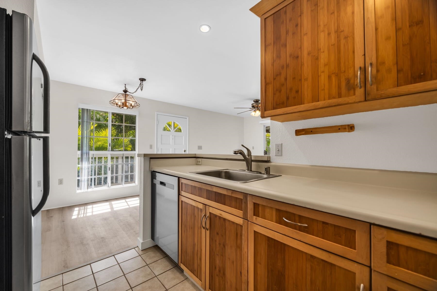 160 Keonekai Road, Unit 18202 Kihei, HI 96753 - Photo 15 of 25 a kitchen with a sink cabinets and window