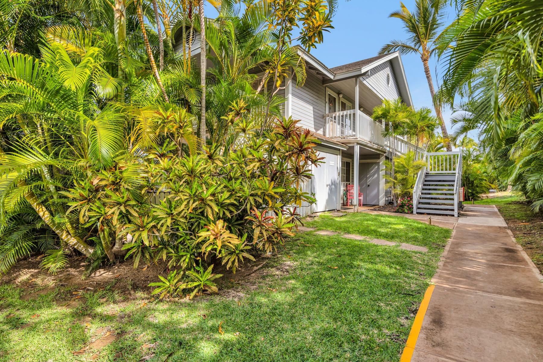 160 Keonekai Road, Unit 18202 Kihei, HI 96753 - Photo 2 of 25 a front view of a house with a yard