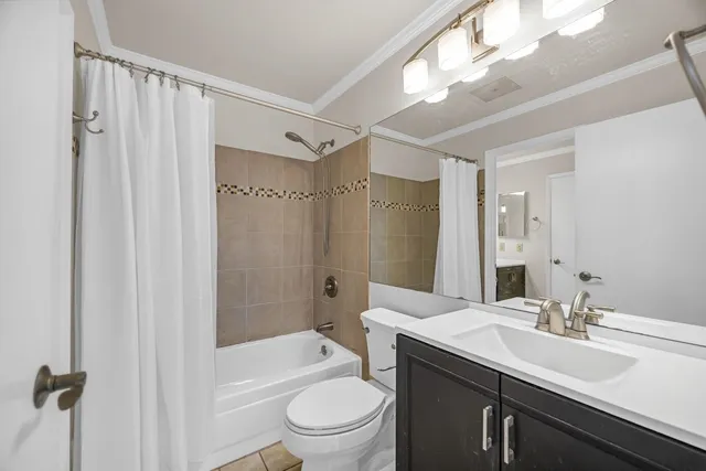 a bathroom with a sink vanity granite and a mirror