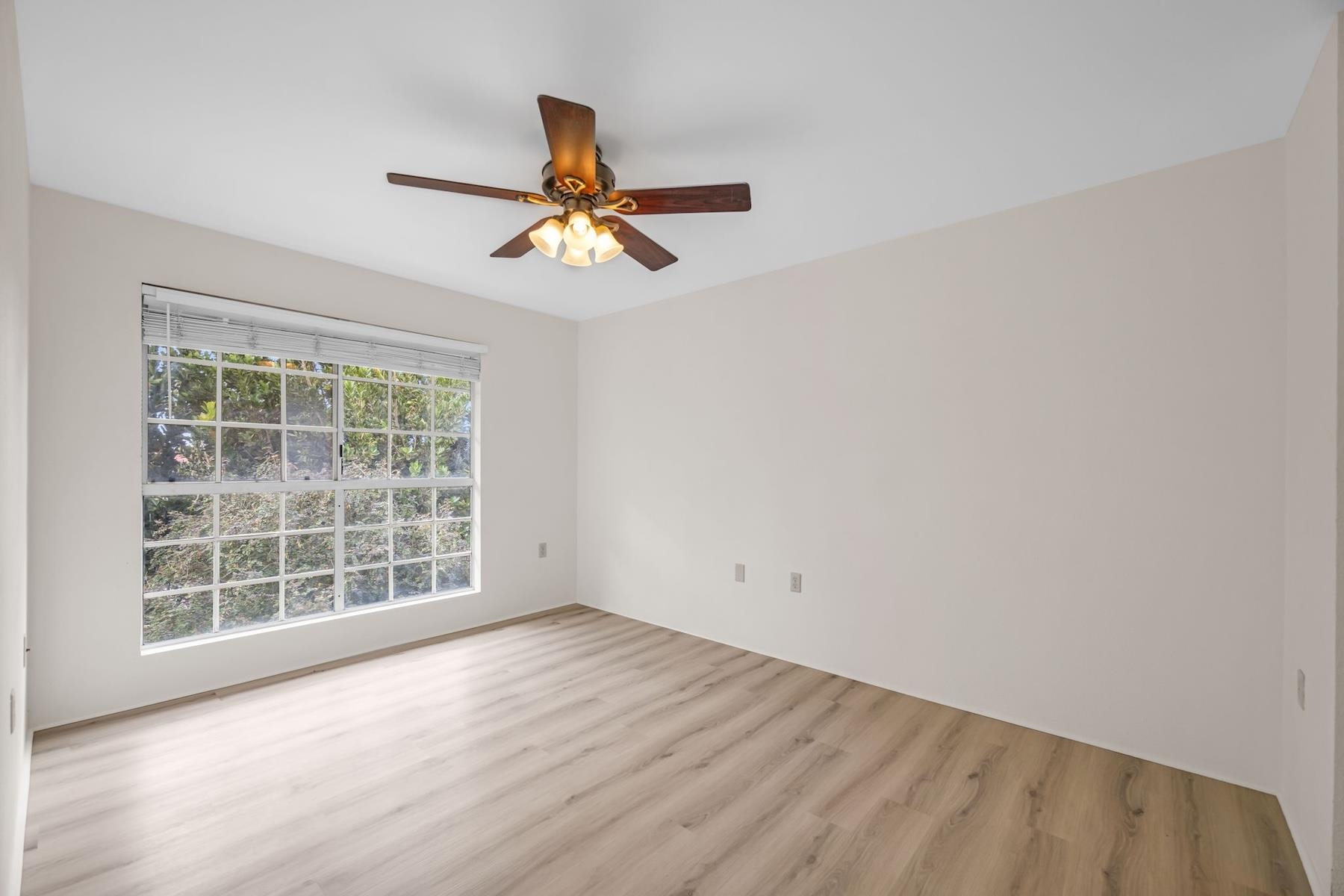 160 Keonekai Road, Unit 18202 Kihei, HI 96753 - Photo 5 of 25 an empty room with a window and a ceiling fan