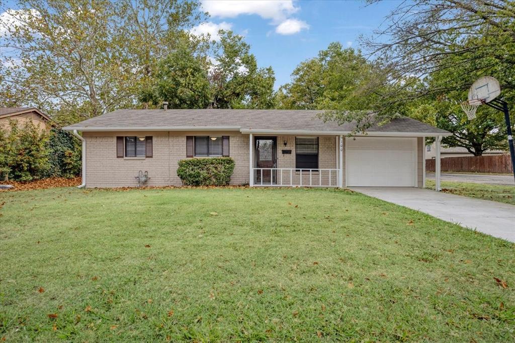 100 East Cunningham Street Bonham, TX 75418 - Photo 2 of 35 a house with huge green field in front of it
