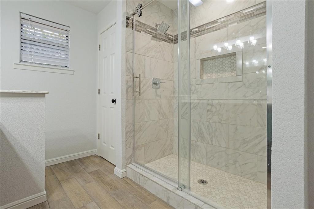 100 East Cunningham Street Bonham, TX 75418 - Photo 24 of 35 a bathroom with a shower