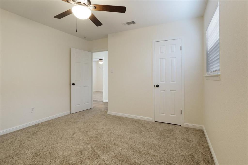 100 East Cunningham Street Bonham, TX 75418 - Photo 29 of 35 an empty room with chandelier fan