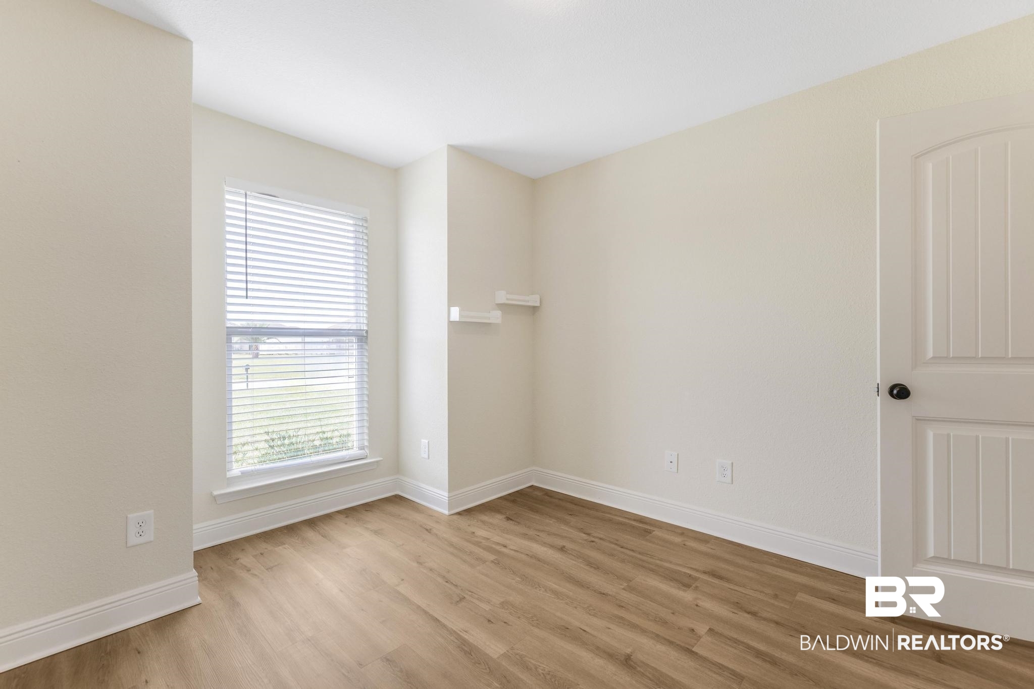 21580 Talbot Lane Robertsdale, AL 36567 - Photo 7 of 25 Spare room with light wood-type flooring and baseboards