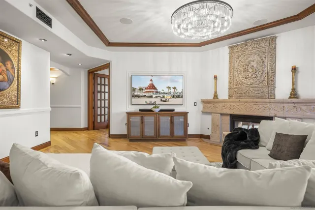 a dining hall with stainless steel appliances a dining table and chairs