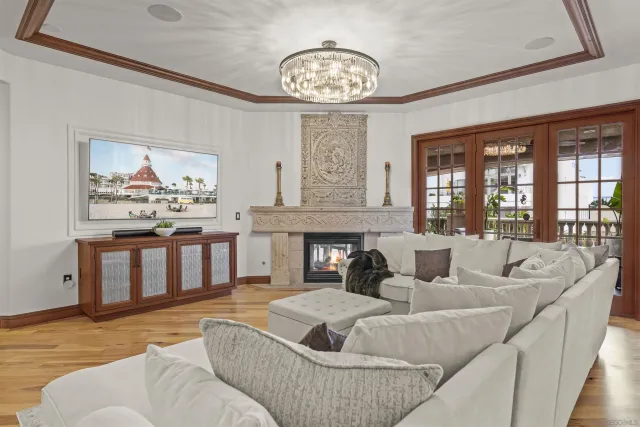 a dining table with chairs and kitchen view