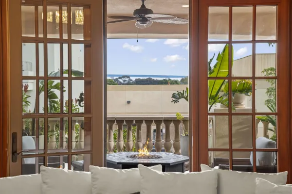 a kitchen with stainless steel appliances granite countertop a table chairs and a refrigerator