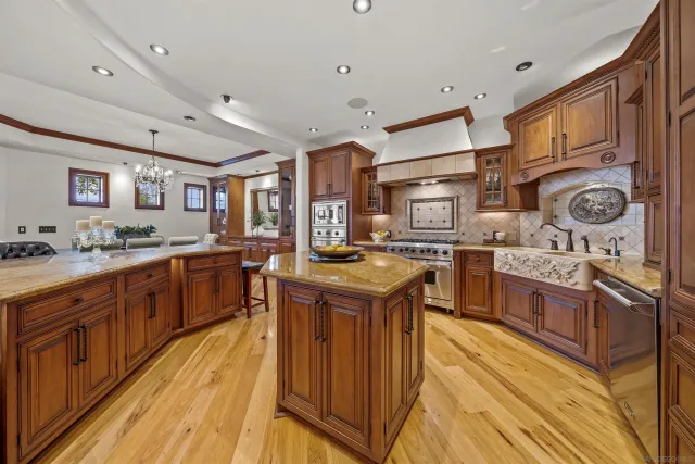 a kitchen with a stove and cabinets