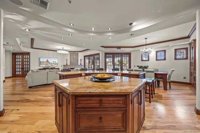 a kitchen with stainless steel appliances granite countertop a sink and cabinets
