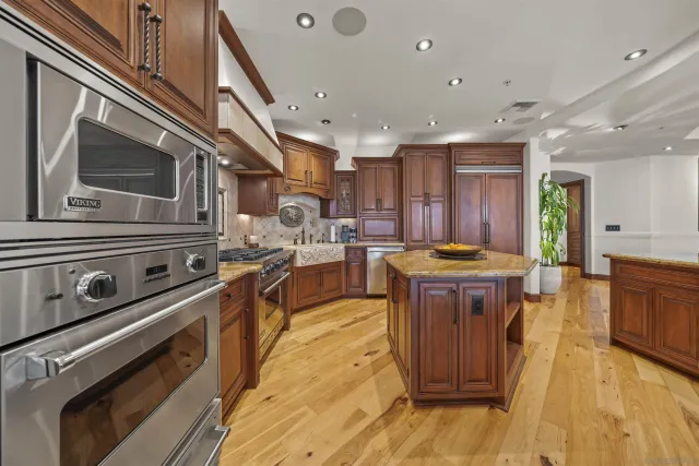 a kitchen with a stove and a microwave