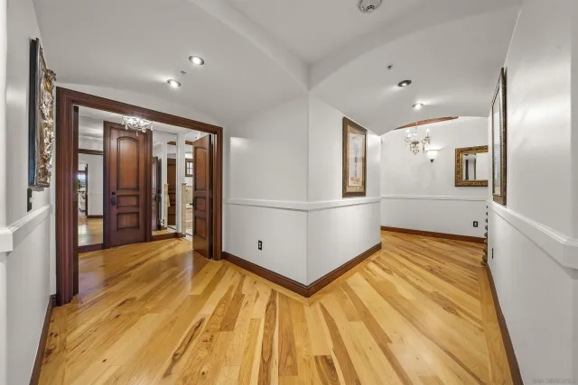 a spacious bathroom with a granite countertop sink and a mirror
