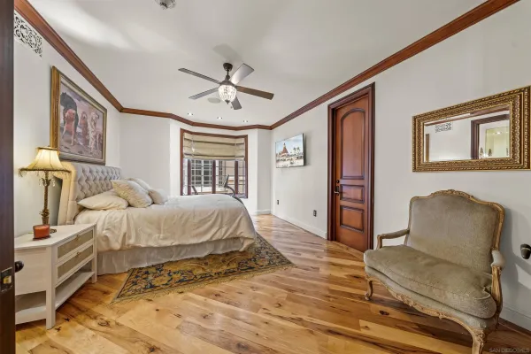 a bedroom with a bed and a lamp