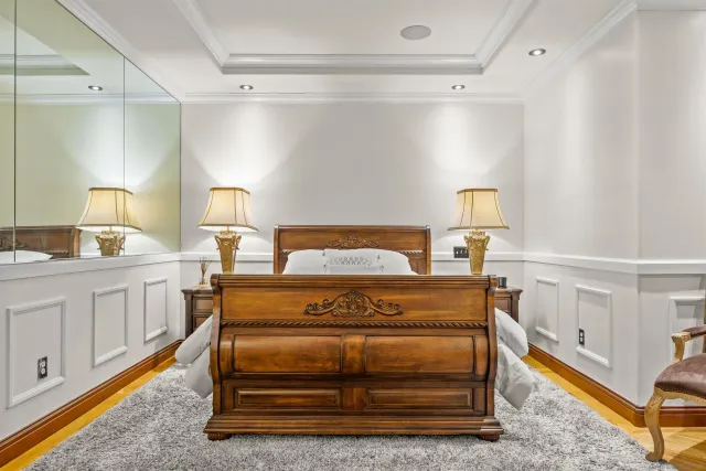a bathroom with a granite countertop tub sink and mirror